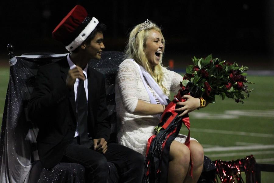 Joshua Sazon and Avalon Johnson ride away shortly after being declared homecoming king and queen.