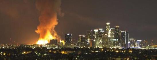 Raging LA fires burn apartment complex