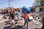 COQUIMBO, CHILE - SEPTEMBER 22: Local residents clean their home of the debris left by the tsunami that ensued an 8.3 quake that left 12 people dead in Coquimbo, 450 km north of Santiago, Chile on September 22, 2015. (Photo by Andres Miranda Munizaga/Anadolu Agency/Getty Images)