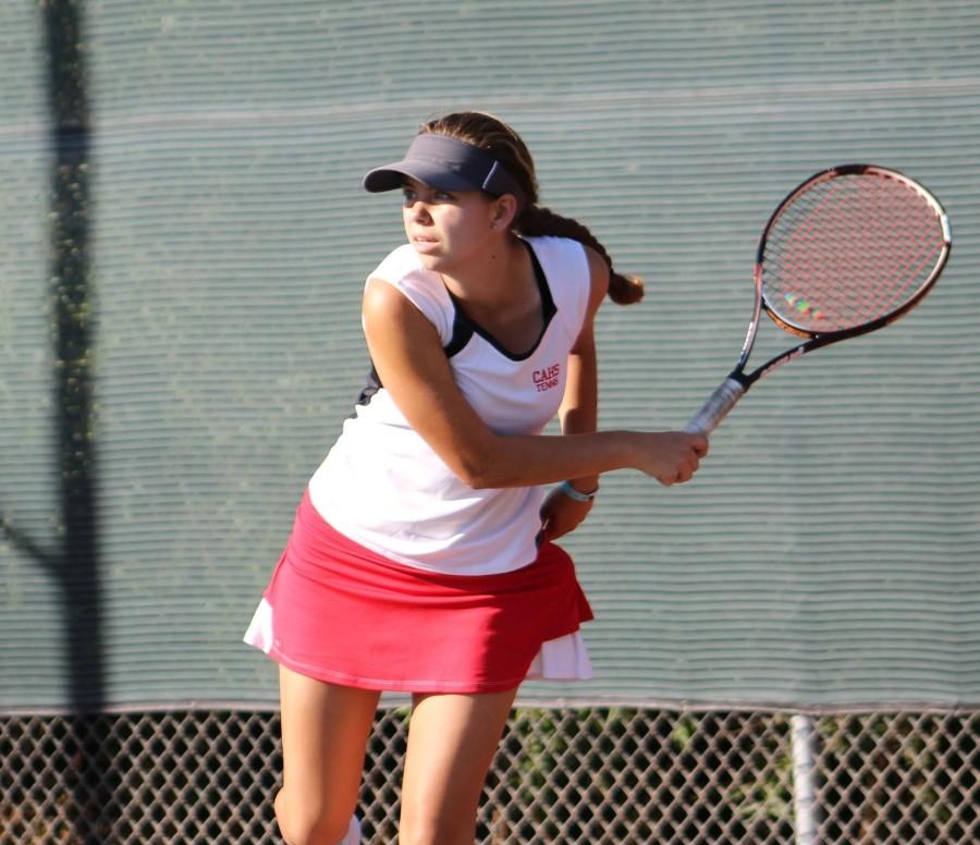 Sophomore Makenna Roehr prepares to perform a backhand stroke as she anxiously waits for the ball to arrive.   