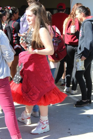 Freshman Cladee Schmaltz demonstrates her school spirit by wearing a black and white polkadot dress with a red tutu underneath.