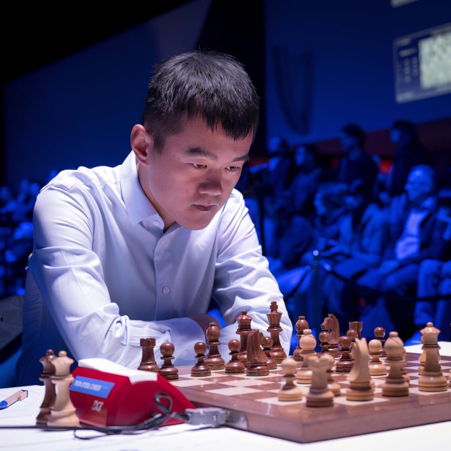 2023s world chess champion, Ding Liren, studies the board.